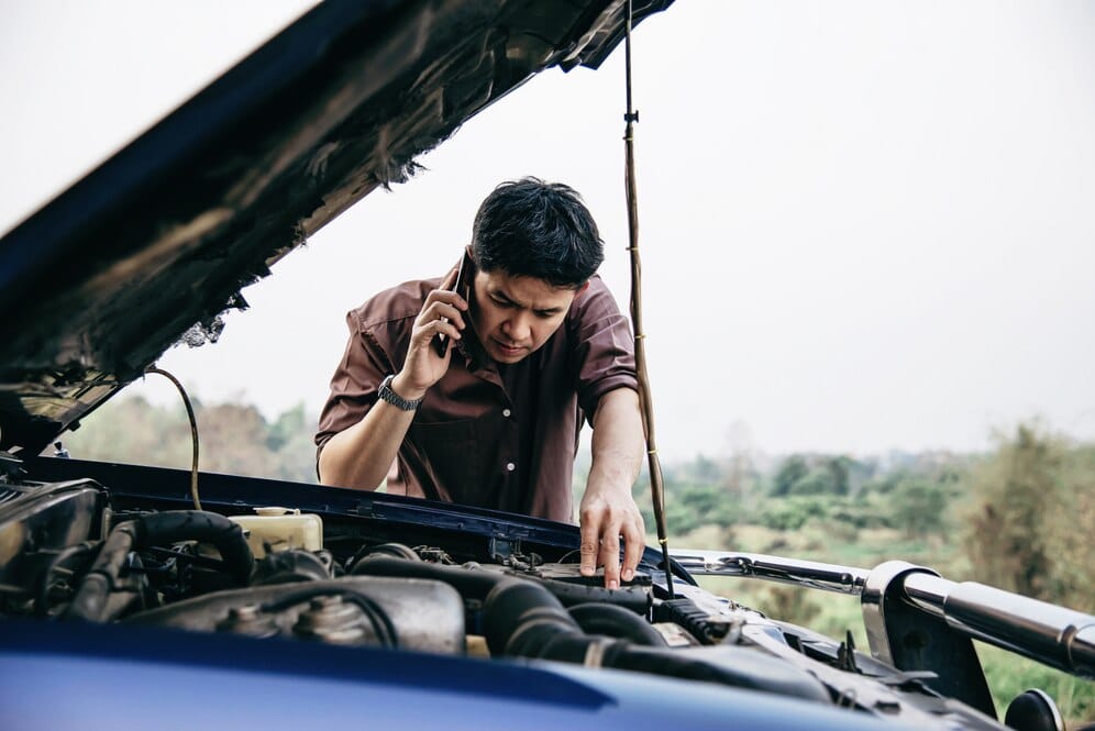a person calling for help after his car failed to start
